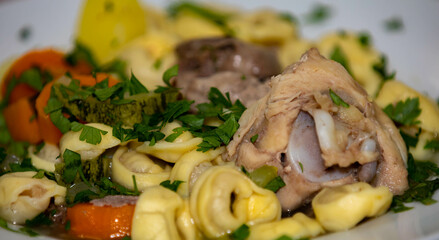 Traditional capeletti soup with chicken and vegetables. Typical winter dinner soup