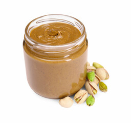 Tasty nut paste in jar and pistachios isolated on white