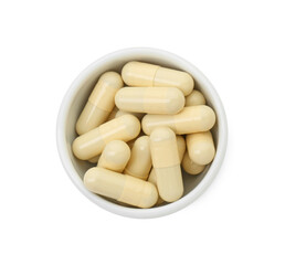 Vitamin capsules in bowl isolated on white, top view. Health supplement