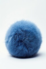 Soft blue fur ball on a clean white background. Perfect for pet care or home decor concepts