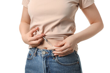 Obraz premium Diabetes. Woman making insulin injection into her belly on white background, closeup