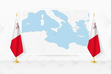 Map of Malta and flags of Malta on flag stand.