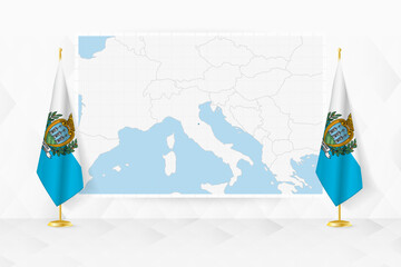 Map of San Marino and flags of San Marino on flag stand.