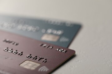 Two credit cards on gray background, closeup