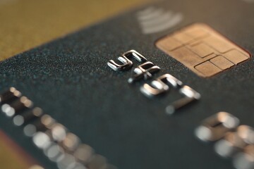 Plastic credit card on table, macro view