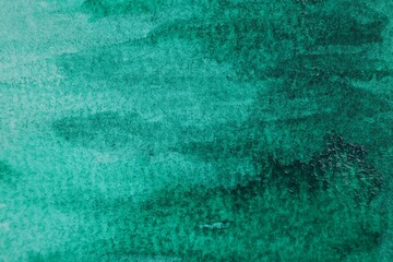 Abstract green watercolor painting as background, top view