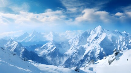 Fototapeta na wymiar Panoramic view of snowy mountain peaks and blue sky with clouds