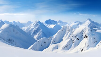 Panoramic view of the mountains covered with snow and blue sky