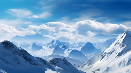Fototapeta na wymiar Panoramic view of snowy mountains and blue sky with white clouds