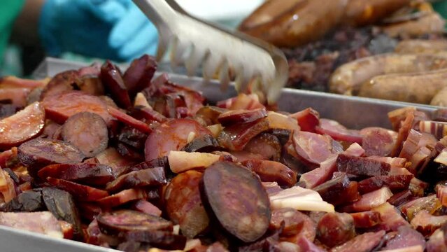 Chorizo (Spanish) or chourico (Portuguese) is type of pork sausage. Traditionally, it uses natural casings made from intestines, a method used since Roman times.