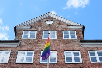 Rainbow flag waving from a building in Copenhagen