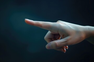 A person pointing their finger at something. Can be used for presentations or educational materials