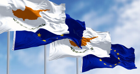 Cyprus national flag waving with the European Union flags on a clear day