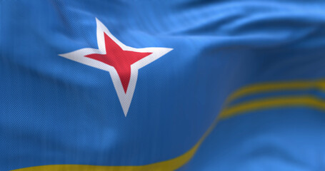 Flag of Aruba waving in the wind on a clear day