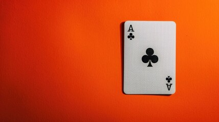 Ace of clubs card against orange background