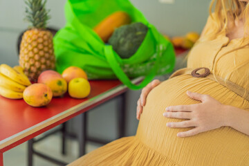 Exhausted but resilient, a pregnant woman feels fatigue after bringing home a sizable bag of...