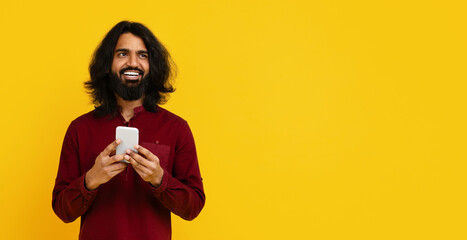 Bearded Man With Long Hair Holding Cell Phone
