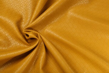 Beautiful yellow leather as background, top view