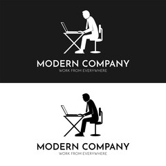 Man sits in chair desk facing Laptop for job sites logo work from everywhere remotely