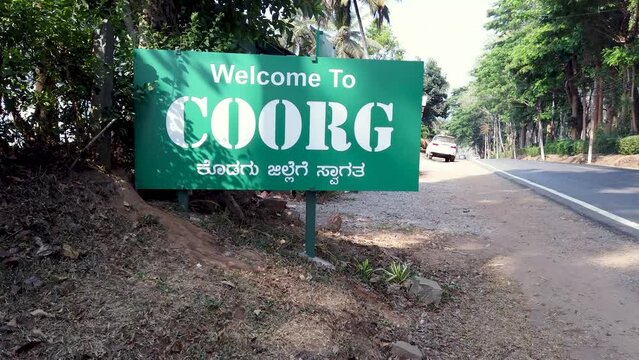 Coorg, Karnataka, India-April 15 2024; A Welcome signboard of Coorg Hill station which is considered as Scotland of Karnataka state because of its cool weather near Mysuru in India.

