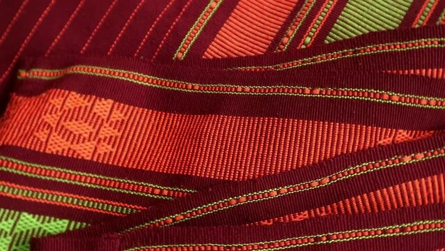 Handmade woven with unique pattern from Indonesia, close up textured fabric background