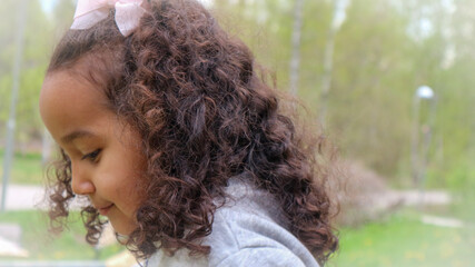 Close-up of girl with curly hair