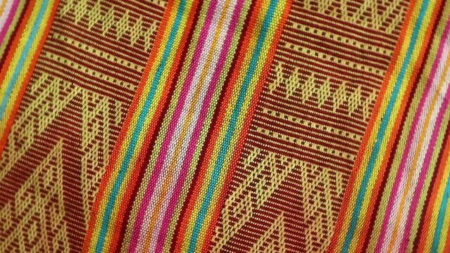 Handmade woven with unique pattern from Indonesia, close up textured fabric background