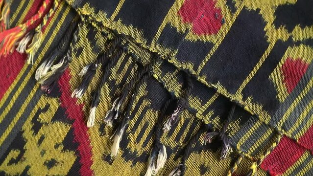 Handmade woven with unique pattern from Indonesia, close up textured fabric background