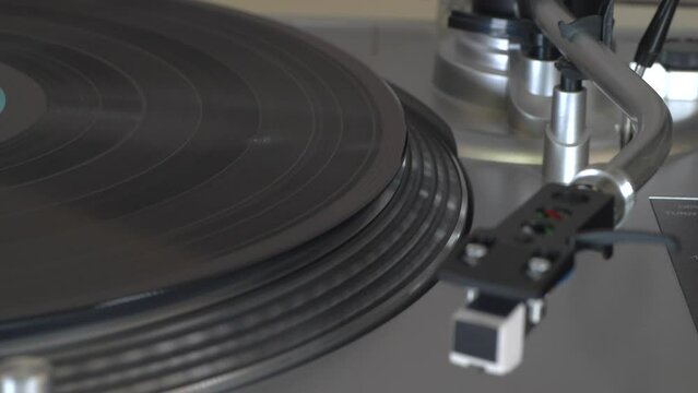Warped record playing on a turntable