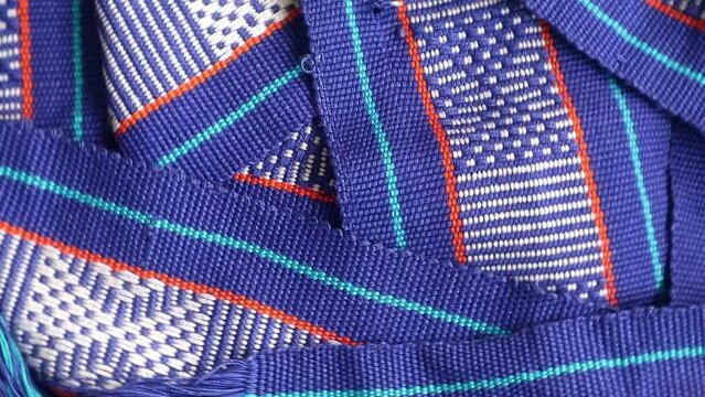 Handmade woven with unique pattern from Indonesia, close up textured fabric background