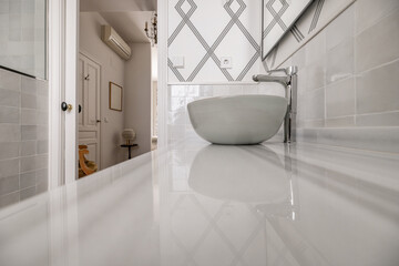 Bathroom with half-circumference single-bowl sink in fired terracotta, not recessed in glossy...