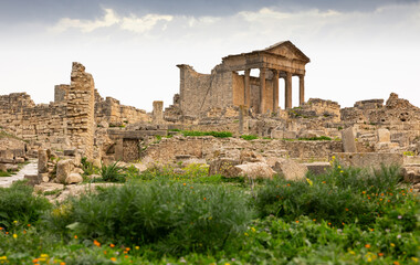 Fototapeta premium View of intact Capitol in archeological site of Dougga in north-west Tunisia