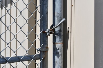 Chain-Link fence gate latch.
