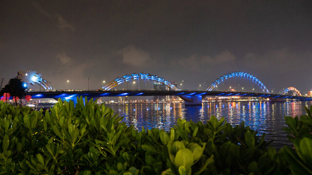 Dragon bridge by harbour at night