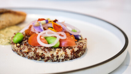 An appetising set meal of Quinoa on a white plate.