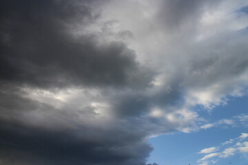 Naklejka na ściany i meble Beautiful dark cloudy sky before the thunderstorm