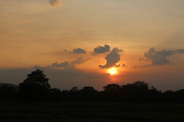 Beautiful colorful dramatic sky with clouds at sunset or sunrise.