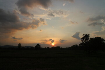 Beautiful colorful dramatic sky with clouds at sunset or sunrise.
