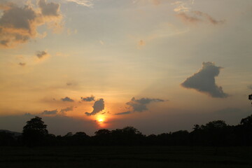 Beautiful colorful dramatic sky with clouds at sunset or sunrise.
