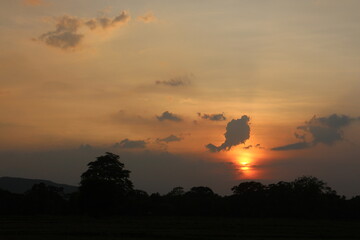 Beautiful colorful dramatic sky with clouds at sunset or sunrise.