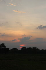 The sky ablaze with hues of orange and pink as the sun gently sank below the horizon making the end of another beautiful day.