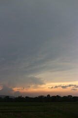 Beautiful Vivid sky painted by the sun leaving bright golden shades. Image of cloud sky on evening time. Evening Vivid sky with clouds.