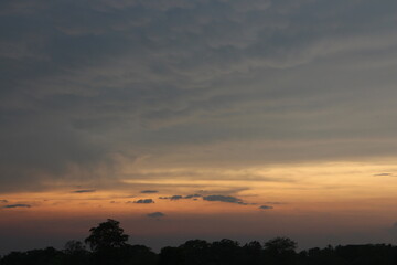 Real amazing panoramic sunrise or sunset sky with gentle colorful clouds.