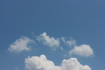 Blue sky with white clouds. Blue background. The summer sky is colorful clearing day and beautiful nature in the morning. for backdrop decorative and wallpaper design.