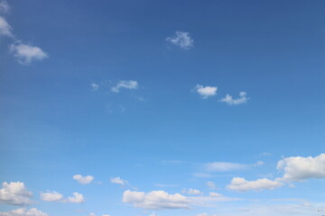 Blue sky with white clouds. Blue background. The summer sky is colorful clearing day and beautiful...