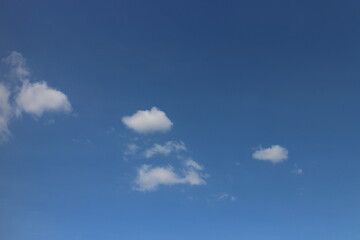 Blue sky with white clouds. Blue background. The summer sky is colorful clearing day and beautiful...