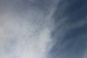 blue sky background with tiny clouds