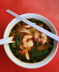 popular street food. Ipoh Hor Fun Soup and Roasted Chicken Drumstick and Roasted Pork Belly with Oily Rice, usually eaten as lunch or dinner