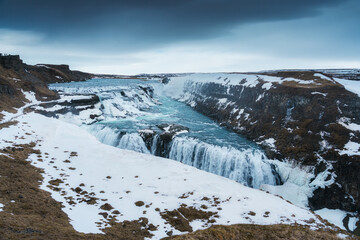 Gullfoss waterfall flowing in Hvita river canyon during winter at Iceland