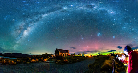 Milky Way, Nebula, Aurora Australis glowing over Church of the Good Shepherd at Lake Tekapo, New...